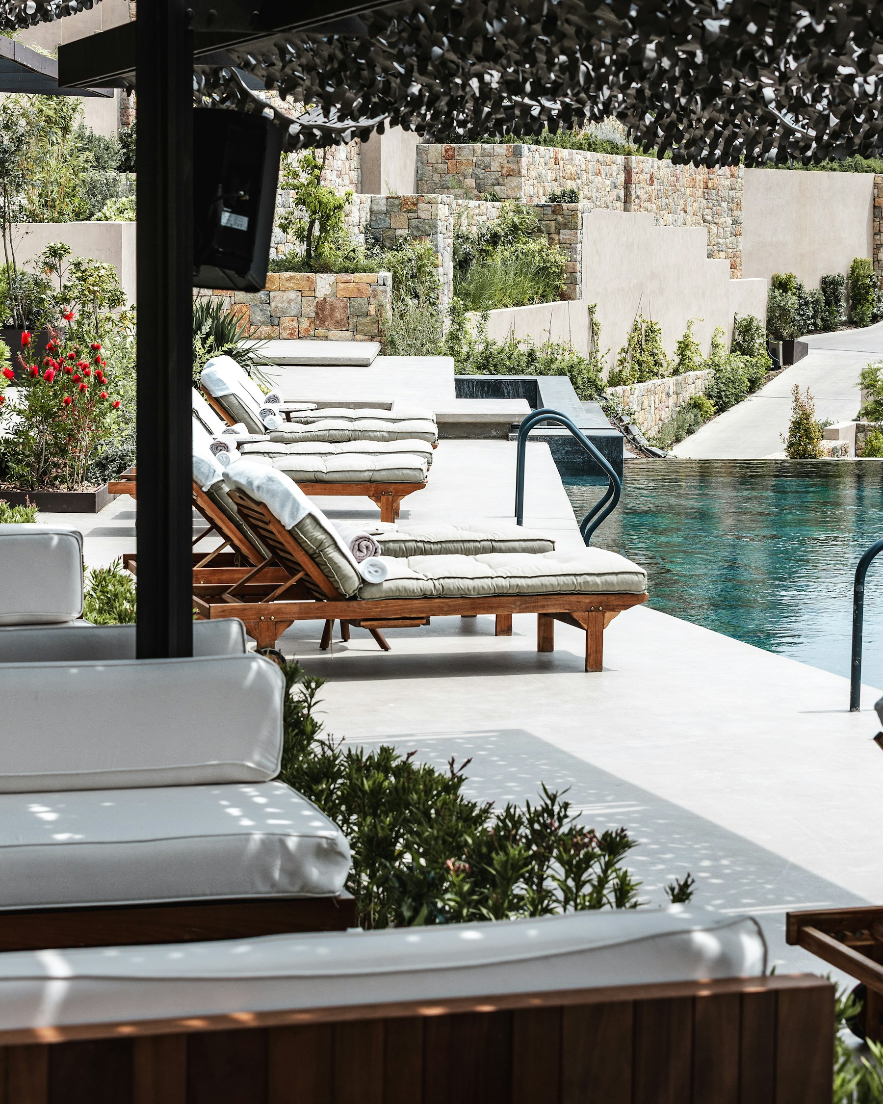 A peaceful sunlit resort pool